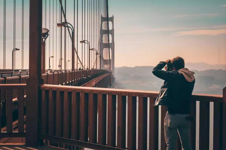 Man taking photos on the Golden Gate Bridge